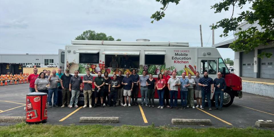 people standing in front of The James mobile kitchen
